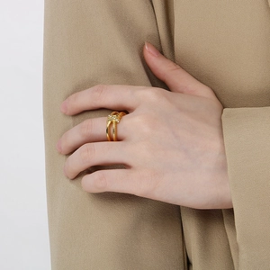 Elegant 18K gold plated stainless steel knot ring with micro-paved sparkling crystals