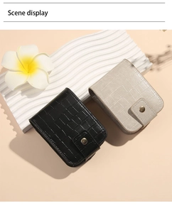 Detail view of mini PU leather lipstick pouches with crocodile pattern and snap closure