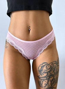 Close-up of pink lace mesh thong with polka dots showing sheer fabric and soft texture
