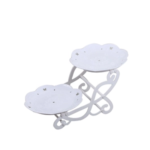 Elegant white metal 2-tier dessert stand with butterfly hollow patterns on white background