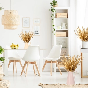 Detail shot of golden artificial eucalyptus stems in vases for elegant home wedding decor