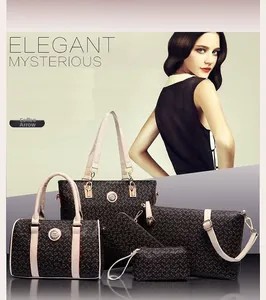 Five-piece brown set of tote bag and purses with arrow pattern and gold hardware
