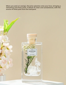 Close-up of reed diffuser bottle N°8 with preserved flowers and hydrangea petals