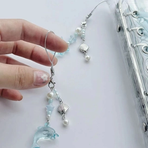 Blue dolphin beaded phone charm with pearls and sea shell pendants for a summer look