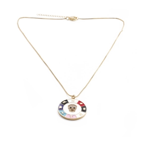 Gold necklace with colorful enamel round pendant featuring a micro-pave skull motif