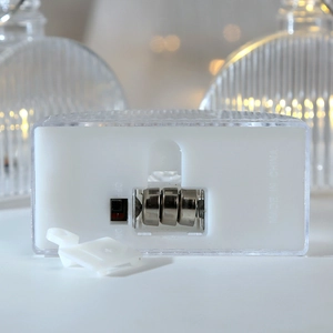 Bottom detail of LED crystal candle light showing battery compartment and power switch