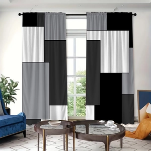 Detail view of polyester curtains featuring modern black and white geometric pattern blocks