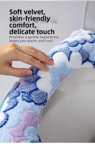 Detail of plush floral toilet seat cover with soft velvet texture and blue flower pattern
