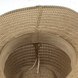 Macro detail of breathable knit cotton hat with inner sweatband and adjustable ribbon
