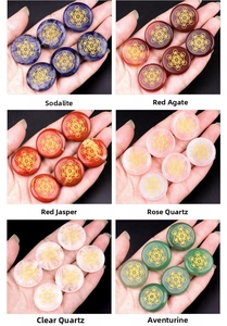 Polished 25mm gemstone discs with golden Metatron's Cube sacred geometry symbols
