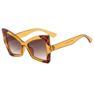 Elegant butterfly cat-eye sunglasses for women in amber orange leopard print