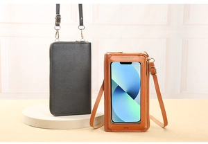 Detail view of touchscreen crossbody phone bags in black and tan faux leather