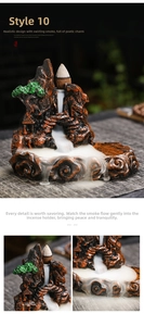 Detail of resin backflow incense burner showing mountain waterfall smoke and tiny pavilion