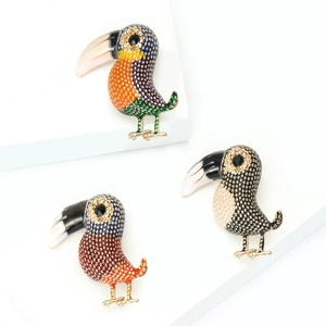 Three elegant vintage toucan bird brooches with colorful enamel and sparkling rhinestones