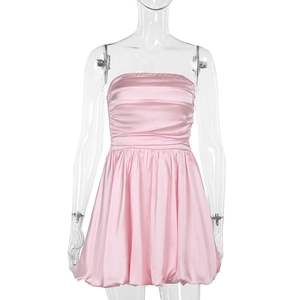 Close-up of light pink satin tube mini dress with pleated bodice and bubble hem design