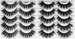 Top view of G07 and G08 thick messy false eyelashes sets in professional white trays