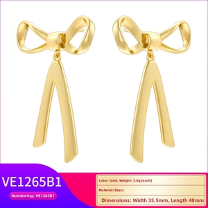 Polished golden brass bow ribbon earrings with dimensions 35.5mm by 48mm and 5.0g weight