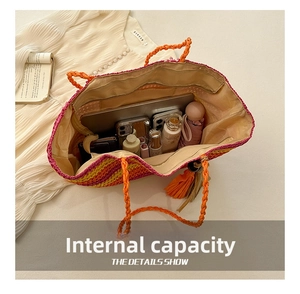 Interior view showing large capacity of the rainbow striped straw tote bag for beach travel