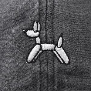 Dark grey washed cotton baseball cap featuring white balloon dog embroidery in front