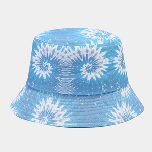 Detailed view of reinforced stitching on blue tie-dye cotton bucket hat brim