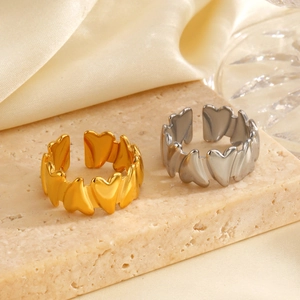 Adjustable heart-shaped stainless steel rings in gold and silver finish set on stone