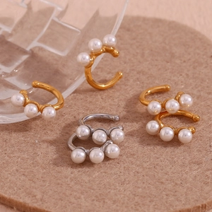 Chic 18K gold and silver plated pearl ear cuffs with white imitation pearls on felt background