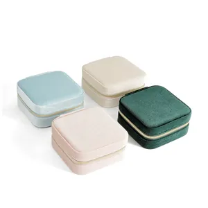 Mini velvet jewelry boxes in four colors with gold zippers and square portable design