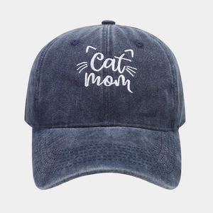 Detailed embroidery of Cat Mom text with whiskers on navy washed cotton baseball cap