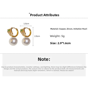 Detailed specs of dolphin earrings with pavé zircons and large white pearls