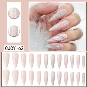 Long almond press-on nails with nude pink ombre and silver glitter sand texture