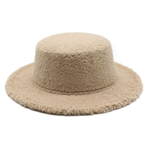 Detailed view of the warm beige teddy fleece texture on the flat top wool hat