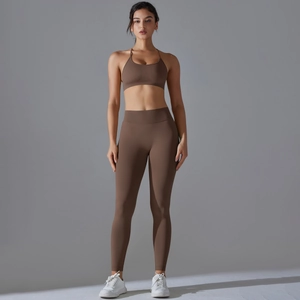 Close-up of seamless dark brown high-waisted yoga leggings and sports bra set