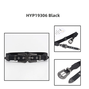 Close-up of vintage black elastic belt featuring dual antique silver engraved buckles