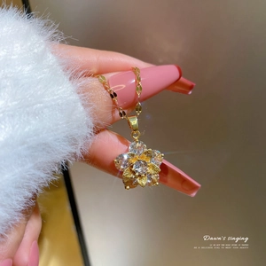 Gold-plated snowflake zircon pendant necklace shown on a model with a cozy vibe