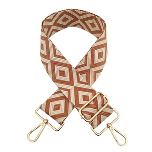 Detail of 5cm jacquard woven strap with brown diamond patterns and gold metal buckles