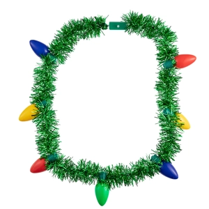 Close-up of green Christmas tinsel wreath with colorful glowing light bulbs for party