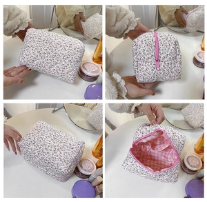Detail view of pink floral cotton makeup bag with internal grid lining and zip closure