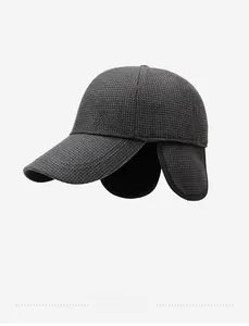 Detail view of winter baseball cap with ear flaps and metallic State logo decoration