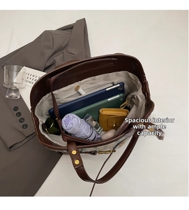 Spacious interior of brown PU leather tote bag showing pockets for tablets and umbrellas