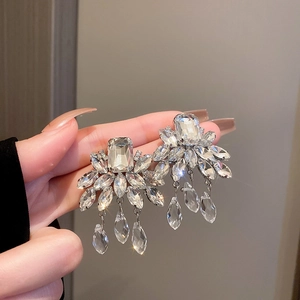 Silver geometric cluster hoop earrings featuring sparkling zircons and a pear-shaped drop
