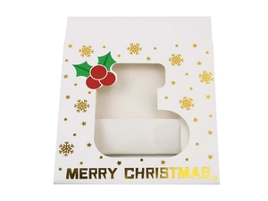 Detail of white Christmas gift box with gold foil snowflakes and sock shaped window