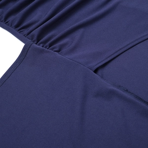 Detail of navy blue knit dress showing fine stitching and elastic fabric texture