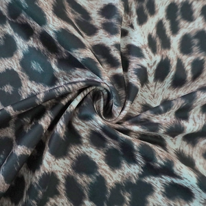 Close-up of leopard print fabric texture showing smooth polyester material detail