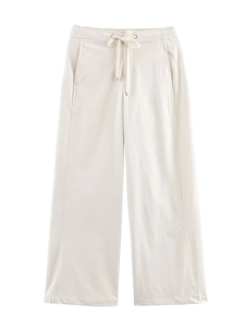 Détail du pantalon large blanc cassé avec taille élastique à cordon et poches latérales