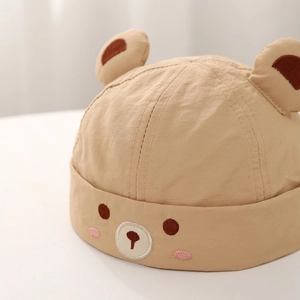 Infant bear-themed brimless cap in khaki cotton with cute animal embroidery and ears