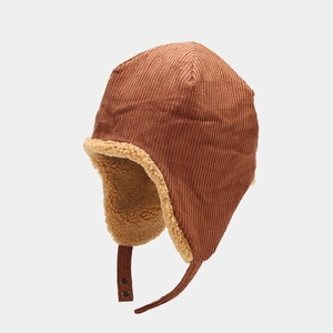 Close-up of brown corduroy trapper hat with thick beige fleece lining and metal buckle