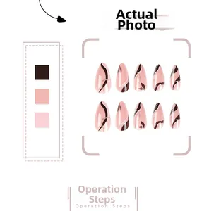 Detail view of pink and brown marble design press-on nails with glitter accents