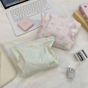 Detailed top view of cloth makeup bags with cute cat patterns and zipper closures