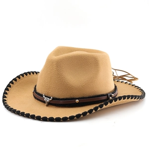 Detail of camel wool felt cowboy hat featuring silver bull head metal and leather band