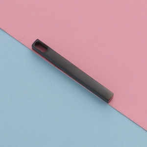 Macro view of matte black stainless steel rectangular bar pendant for DIY jewelry